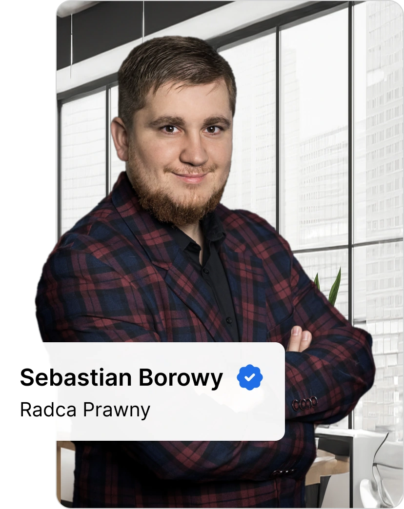 Sebastian Borowy, radca prawny specjalizujący się w sprawach dotyczących wypadków w pracy, na tle nowoczesnego wnętrza.
