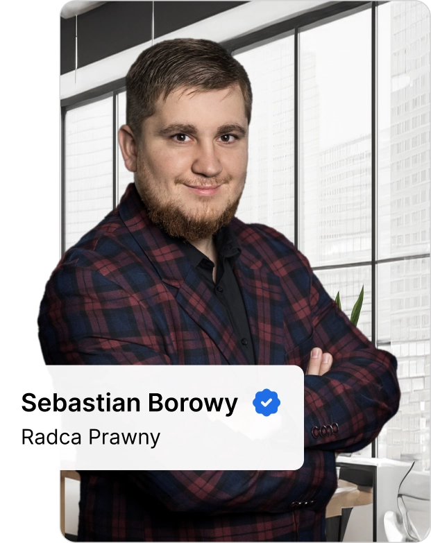 Sebastian Borowy, radca prawny specjalizujący się w sprawach dotyczących wypadków w pracy, na tle nowoczesnego wnętrza.