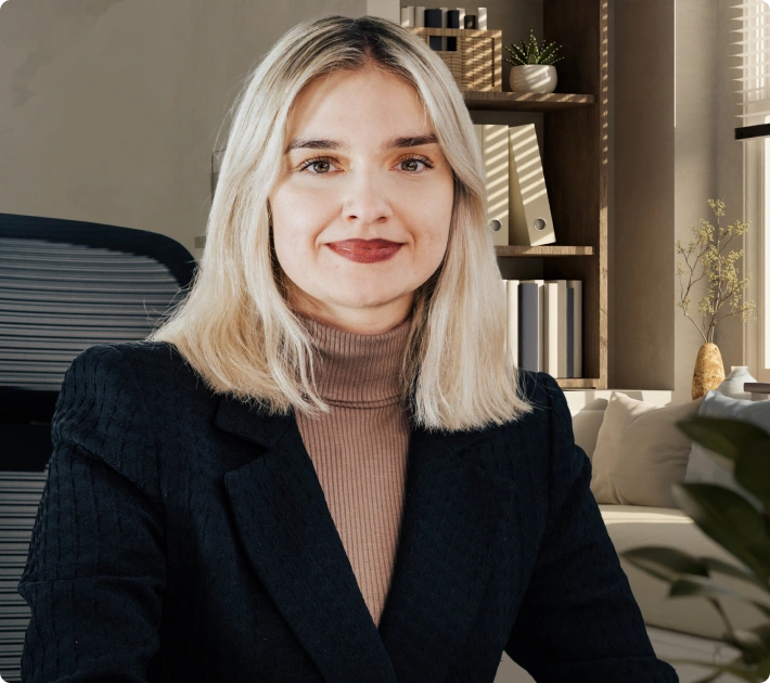 Aleksandra Bryniarska-Duda, adwokat specjalizująca się w sprawach dotyczących błędów medycznych, na tle stylowego biura.